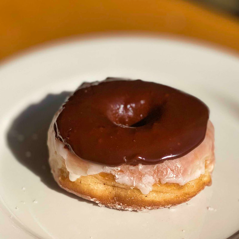 Chocolate covered Raised Glazed Donut